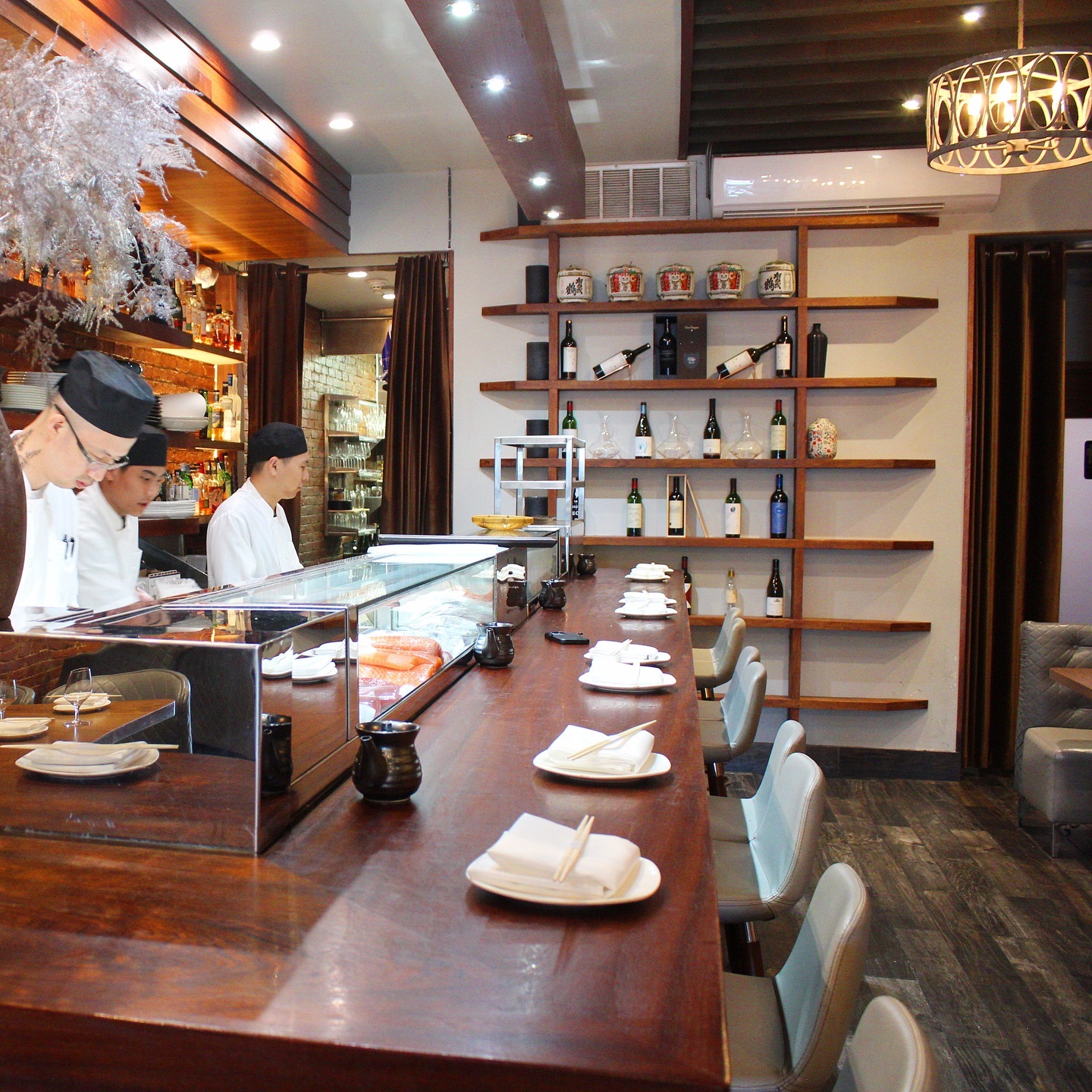 Sushi counter and chefs inside Miku Sushi
